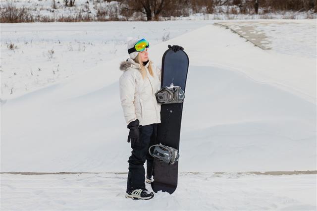 Young Sexy Woman With Her Snowboard