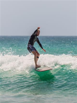 Australian Surfer Catching A Wave