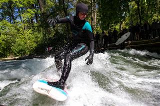 Surfing Girl At The Riverwave
