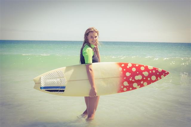 Pretty Blonde Woman Holding Surf Board