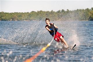 Teenage Boy Water Skiing On A Lake