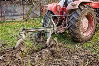 Tractor Ploughing The Land