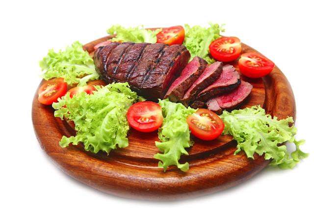 Roast Meat On Wooden Plate