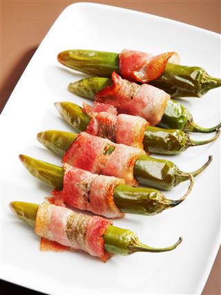 Grilled Jalapenos Wrapped In Bacon