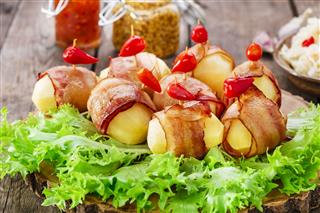 Potatoes Wrapped In Bacon And Baked