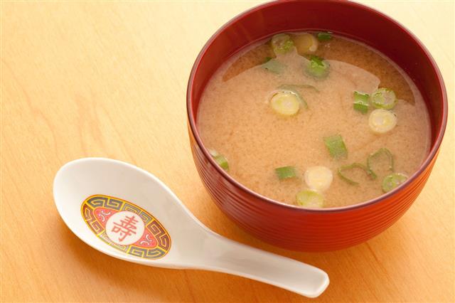 Bowl Of Miso Soup On Wooden Surface