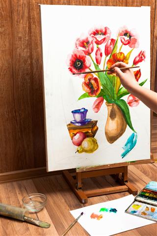 Painter Drawing Watercolor Flowers