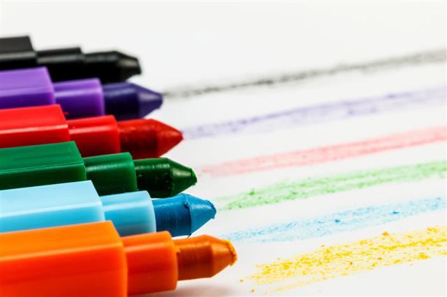 Colorful Crayons On White Paper