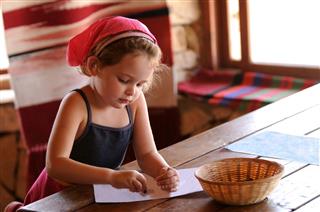 Little Girl Coloring With Crayons