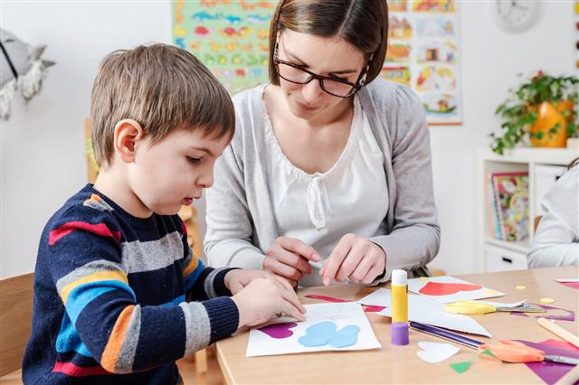 Mother And Kid Doing Craft Art