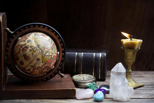 Old astrology globe and books