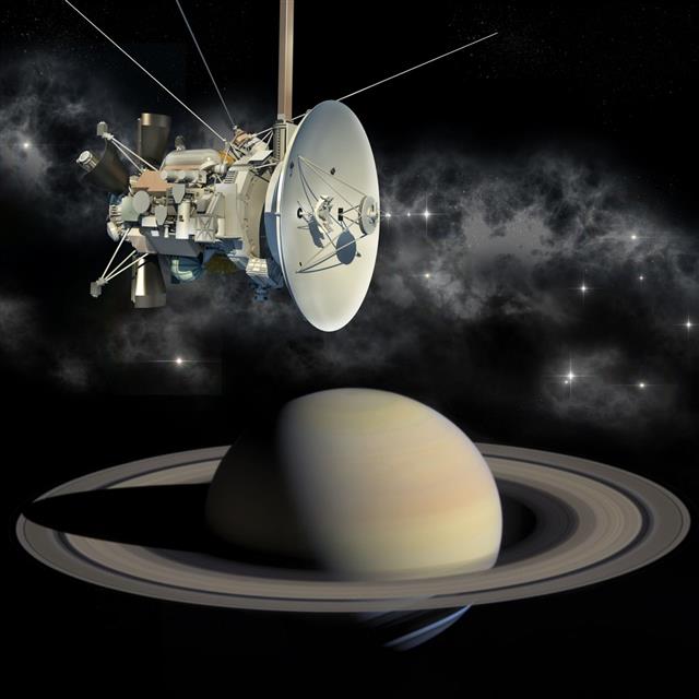Cassini mission orbiter passing Saturn