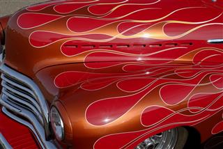 Copper Flames On Red Car