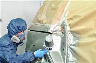 Worker Painting Car