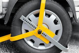 Locked Car Tire With Wheel Clamp