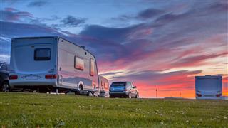 Caravans And Cars At Sunset