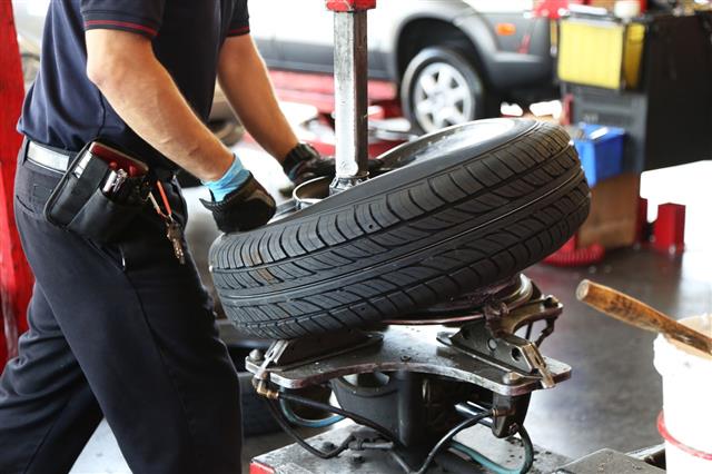 Mechanic Changing Car Tire