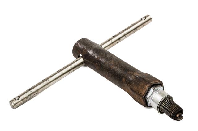 Old Wrench Key And Spark Plug