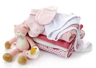 Pile Of Pink Baby Clothes