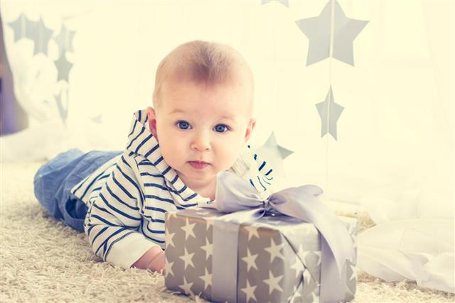Baby boy with gift box
