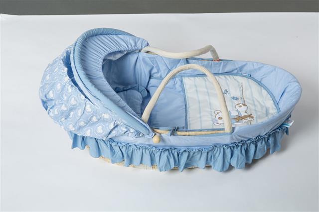 Wicker Cot With Flower And Bear