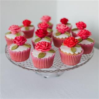 Cup cakes on glass cake stand