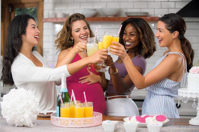 Group of women friends celebrating baby shower