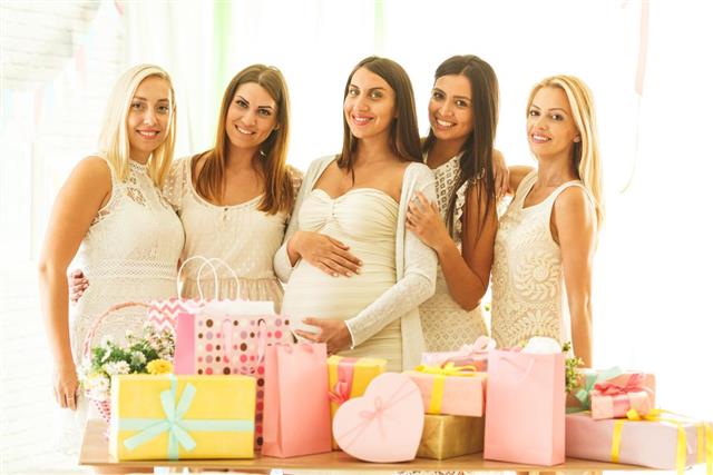 Pregnant woman with her female friends