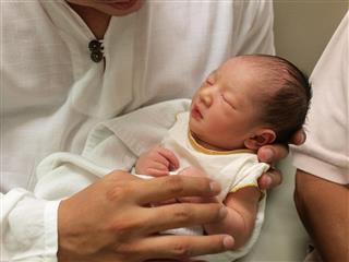 Newborn baby in the hand