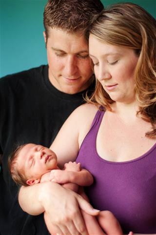 Mother & Father with Newborn Baby