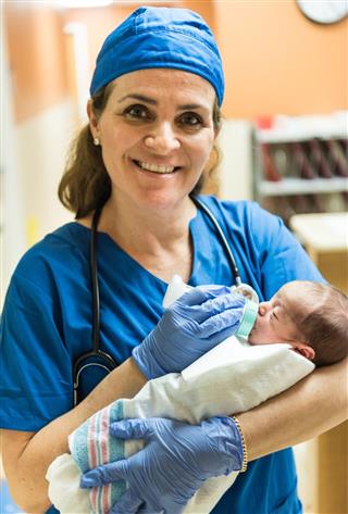 Nurse feeding a newborn