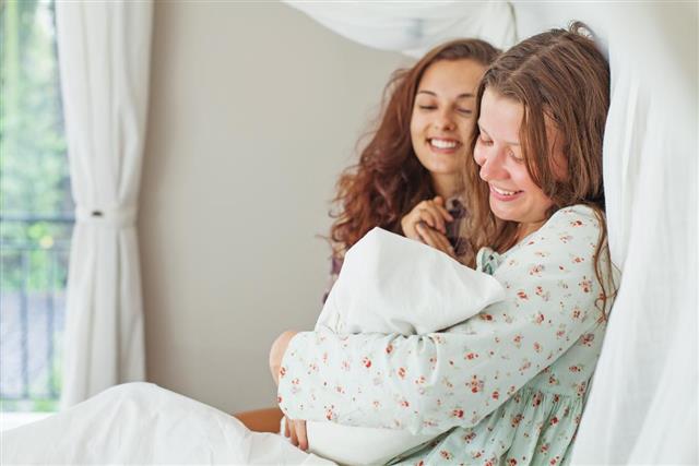 Woman supports her sister after a childbirth