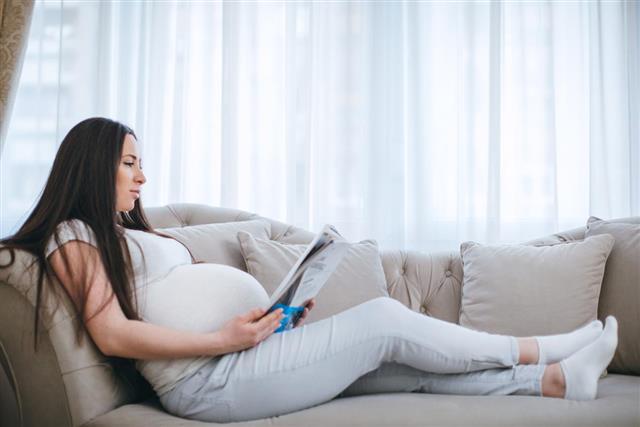 Pregnant woman has a rest at home