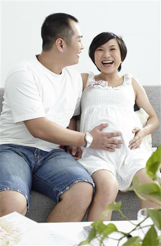 Chinese pregnant woman and her husband