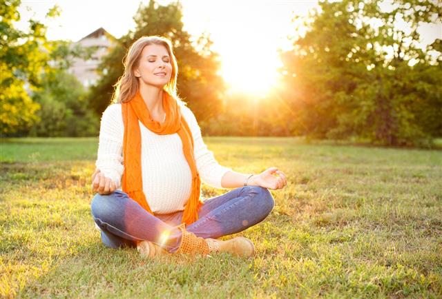 Pregnant woman enjoying sun