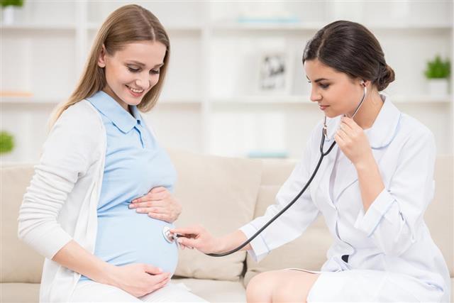 Gynecologist checking Pregnant Woman