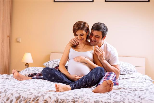 Pregnant woman and her husband spending time together