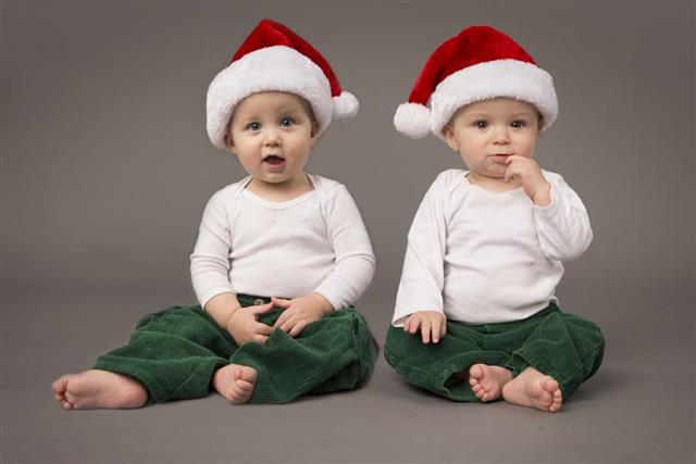 Young Toddlers wearing Santa Hats