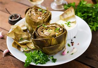 Baked Artichokes Cooked With Garlic Sauce