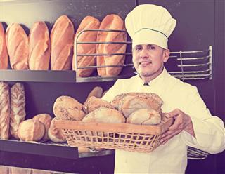 Male Worker With Fresh Bread