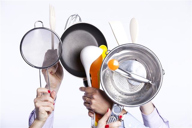 Hands Holding Kitchenware Tools