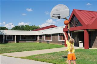 Child Shooting Basketball