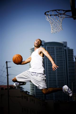 Man Jumping With Basketball