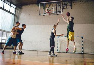 Group Of Friends Playing Basketball