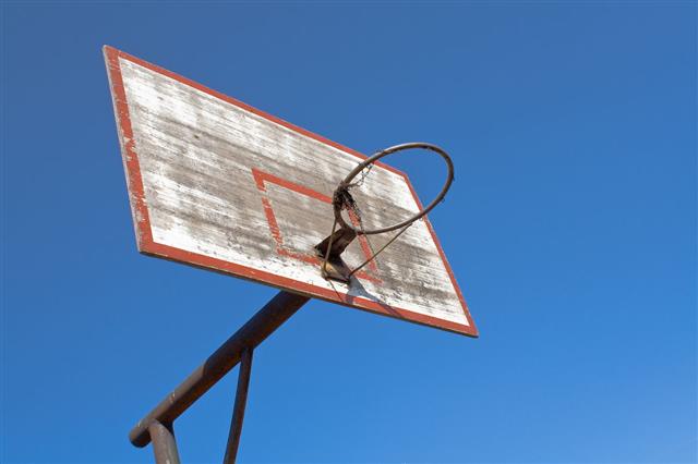 Old Basketball Hoop Over Blue Sky