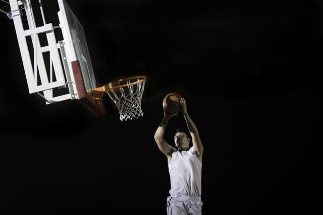 Basketball Player Scoring A Basket