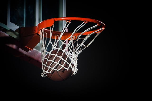 Ball Falling Through A Basketball Hoop