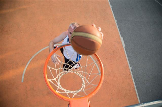 Basketball Player Making Slam Dunk