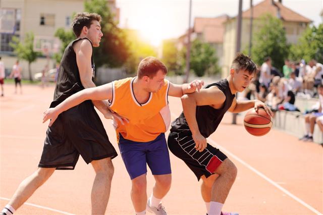 Group Of Friends Playing Basketball