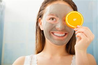 Woman With Mud Facial Mask